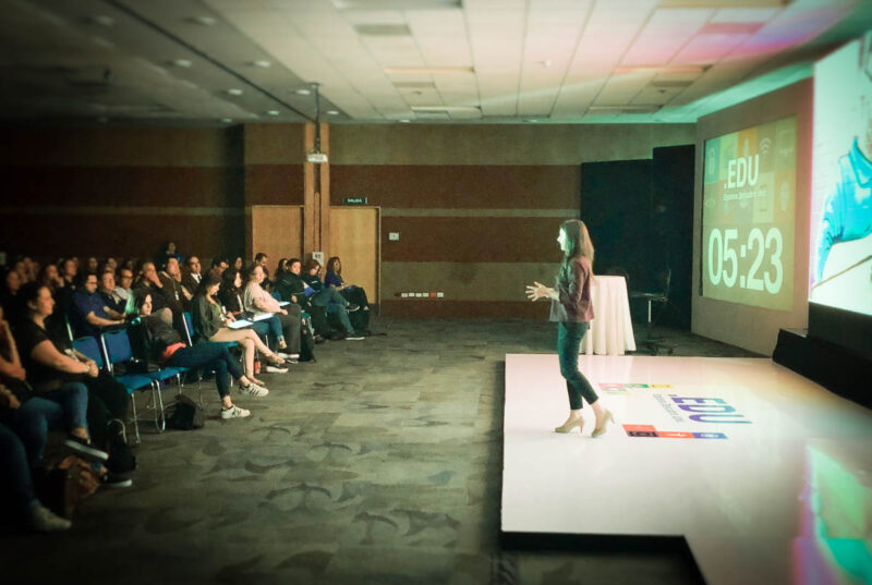 Monica Burns, EdTech Consultant, speaking on stage for educators at a Professional Development Day