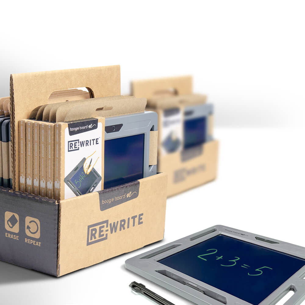 Box of Boogie Board kids writing tablets on a desk, showcasing an innovative, tech-forward writing solution for classroom use.