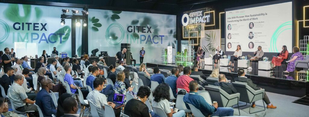 Teen program panel event showcasing global leaders discussing sustainability and innovation in a professional conference setting.